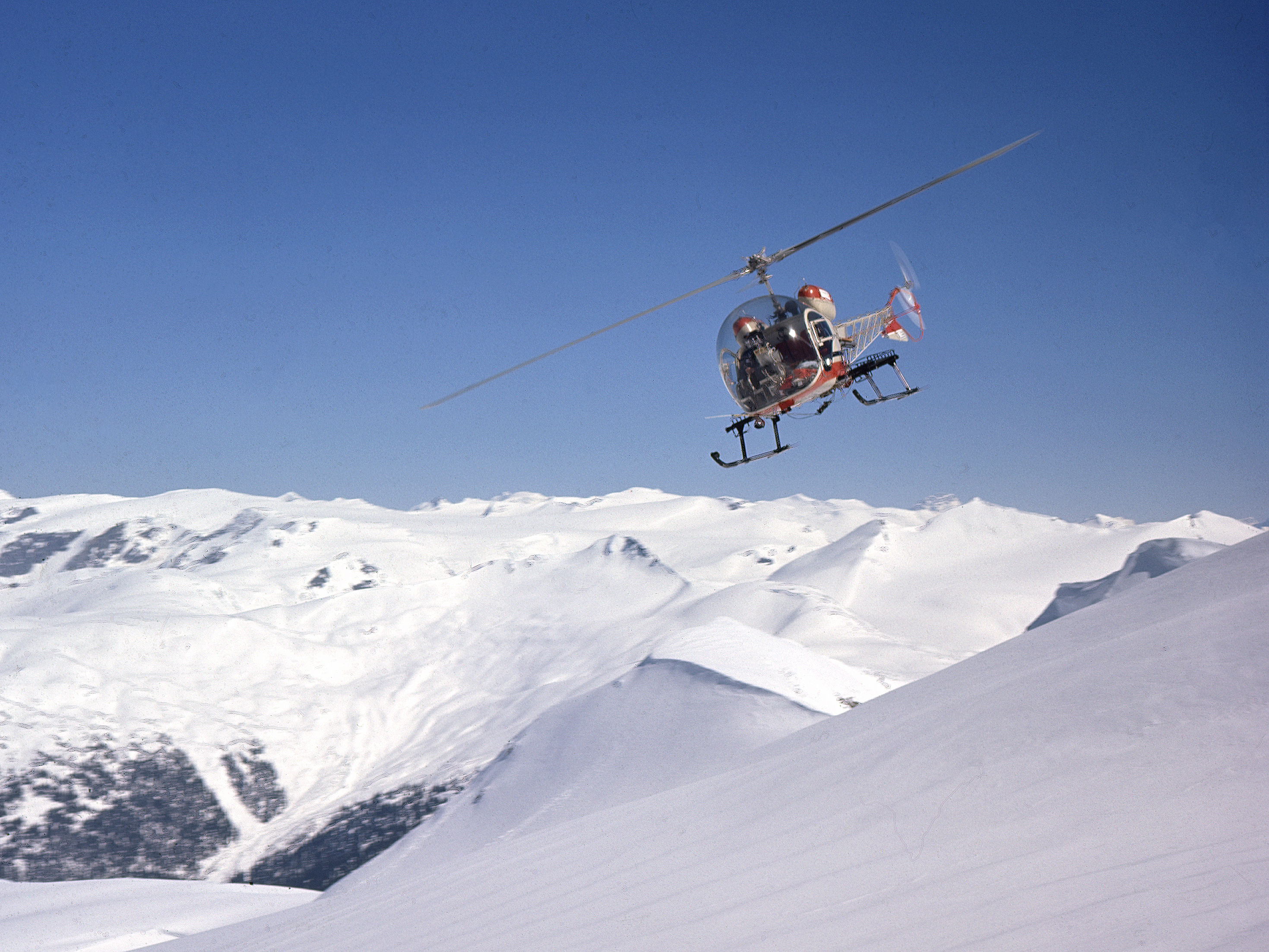 Helicopter Skiing in 1960 with pioneer Mike Wiegele Heli-skiing.