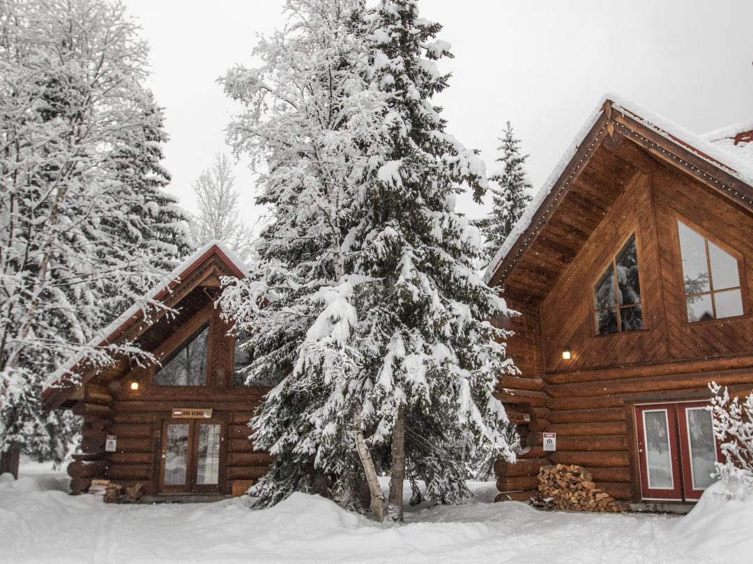 Rest well after a great ski day in the mountains in your cozy log chalet at Mike Wiegele Heli-ski Resort.