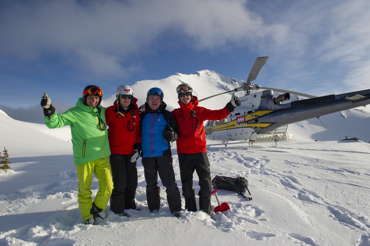 Carlos Fortunato, Mike Wiegele, Neil MacGillvary and Lead Guide Crosby Johnston on top of Hummingbird Valley.