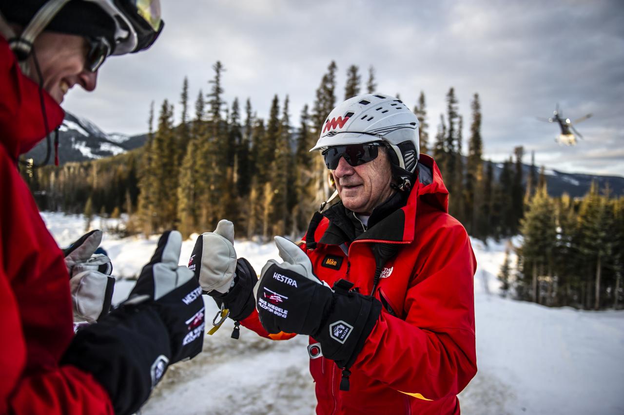Crosby Johnston fist bumping Mike following his first run of the season on Saddle Mountain