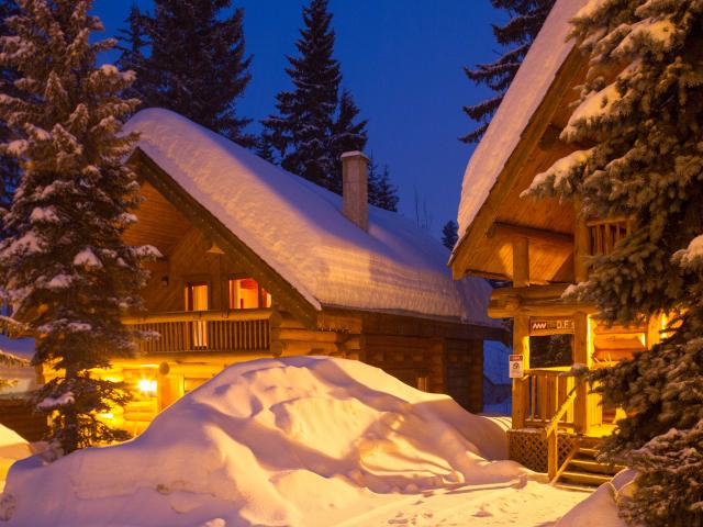 Log chalet ski accommodation at Mike Wiegele Heli-skiing Resort, BC, Canada